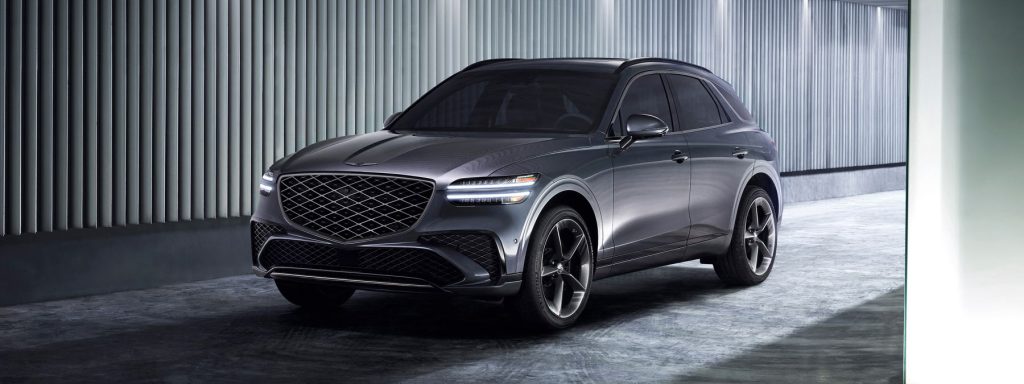 A 2026 Genesis GV70 is displayed prominently, showcasing its sleek design and modern features.