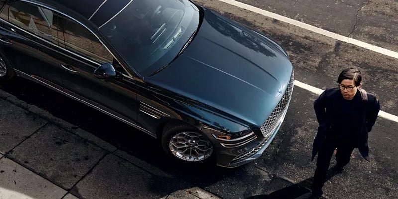 A sleek luxury sedan Genesis G80 is viewed from top.