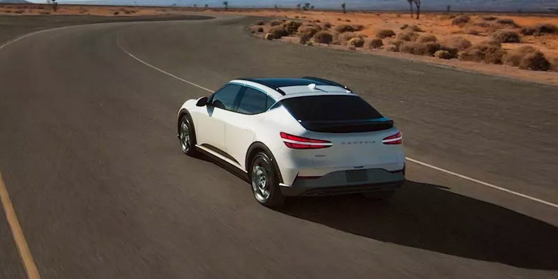 Amazing SUV Genesis GV60 running on road.