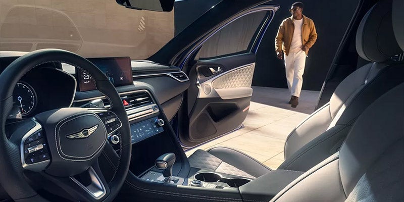 Interior and front right door open shown here of Genesis vehicle.