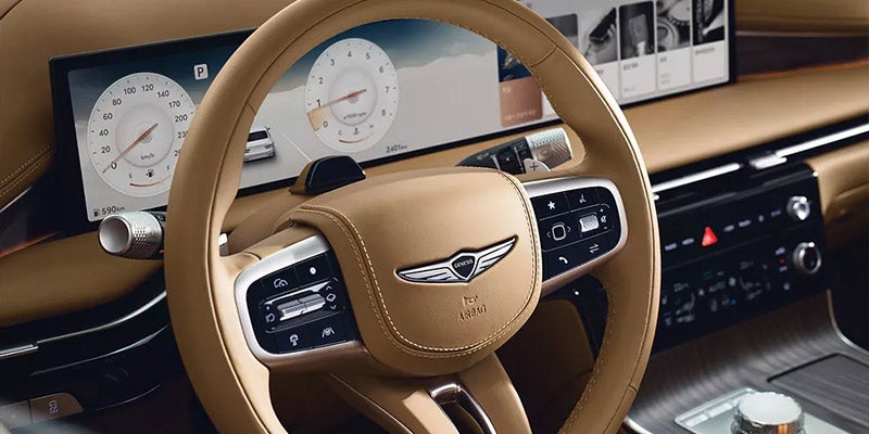 Luxury car interior with leather steering wheel and digital dashboard