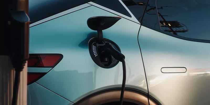 A Genesis GV60 electric SUV charging.